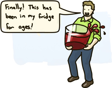 A man hauls a large bucket of blood.